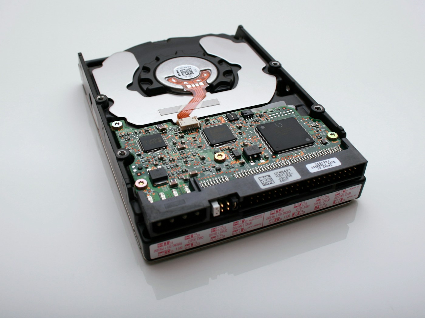 Open hard disk drive showing its internal components